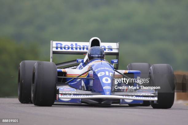 Adrian Newey of Great Britain and chief technical officer of Red Bull Racing drives the Williams FW16 during day two of The Goodwood Festival of...