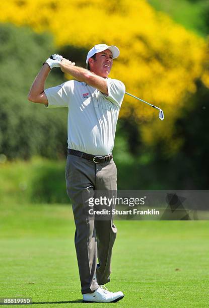 Richard Green of Australia plays his approach shot on the first hole during the third round of the Open de France ALSTOM at the Le Golf National Golf...