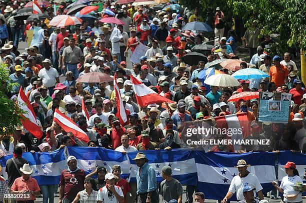 Supporters of ousted Honduran President Manuel Zelaya march against the military coup in Tegucigalpa on July 4, 2009. The political and diplomatic...