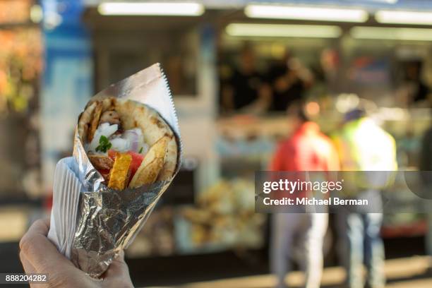 greek souvlaki from a food truck in queens, ny - souvlaki stockfoto's en -beelden
