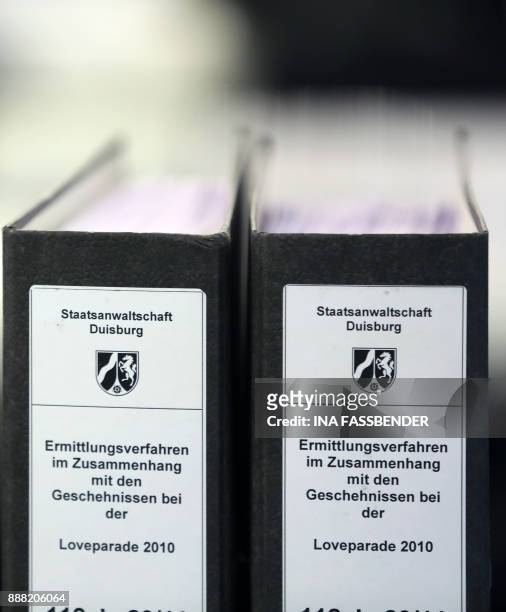 Criminal files stand in the courtroom on the fairground in Duesseldorf, western Germany, on December 8, 2017 ahead the beginning of the trial against...