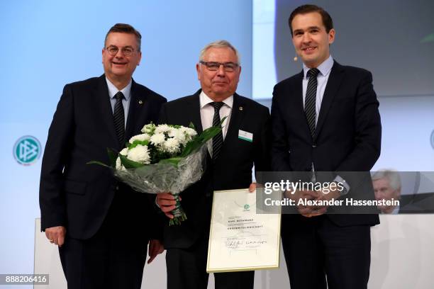 Karl Rothmund is awarded with the DFB honorary membership by DFB president Reinhard Grindel and DFB general secretary Dr.Friedrich Curtius during the...