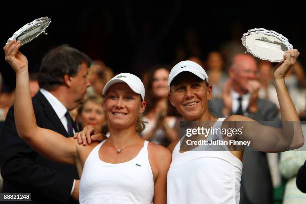 Samantha Stosur of Australia and Rennae Stubbs of Australia pose with their runner up trophies after the women's doubles final match against Venus...