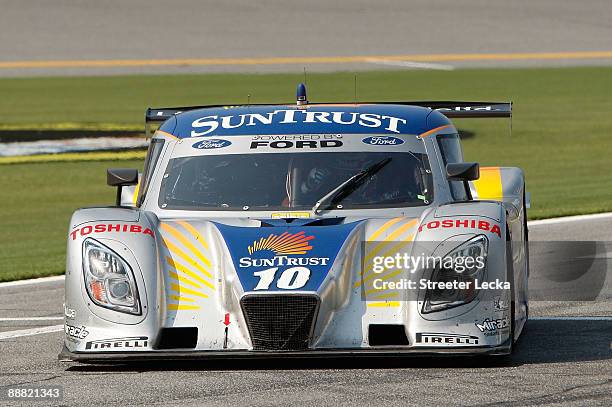 The SunTrust Racing Ford/Dallara, driven by Max Angelelli and Brian Friselle, drives on pit road after winning the Rolex Grand-Am Sports Car Series...