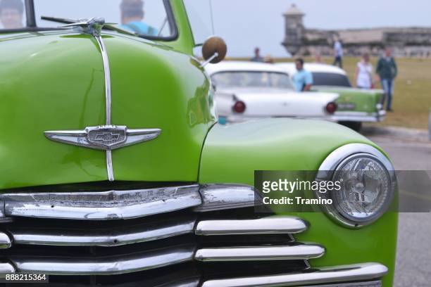 headlight and grille in a classic american car - limousine logo stock pictures, royalty-free photos & images