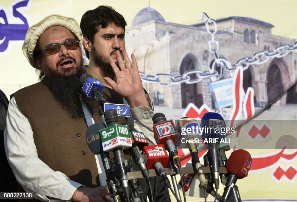 Pakistani head of the Jamaat-ud-Dawa organisation Hafiz Saeed speaks to supporters during an anti-US and Israeli protest in Lahore on December 8...