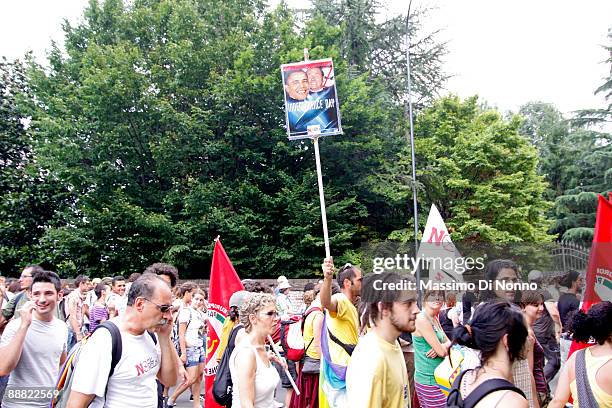 Demonstrators with a placard with Barak Obama and Silvio Berlusconi face during Protests In Vicenza Against US Military Base Expansion on July 4,...