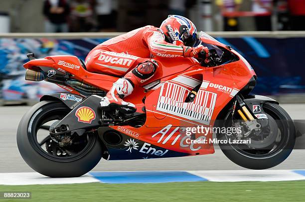 Nicky Hayden of USA and Ducati Malboro Team lifts the front wheel during qualifying practice for MotoGP World Championship U.S. GP at at Mazda...