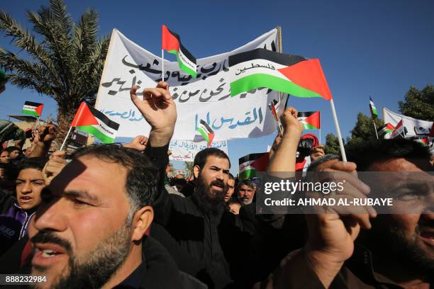 Iraqi supporters of Shiite cleric Moqtada al-Sadr demonstrate after the Friday noon prayers in Baghdad on December 8, 2017 to denounce the widely...