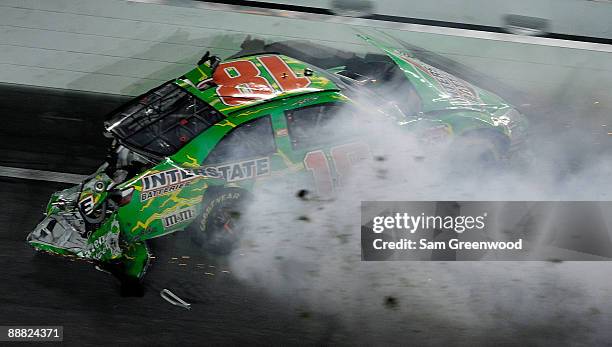 Kyle Busch, driver of the Interstate Batteries Toyota, crashes on the final lap during the NASCAR Sprint Cup Series 51st Annual Coke Zero 400 at...