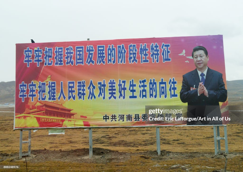 Chinese president Xi Jinping propaganda billboard about development and a good life for the people, Qinghai province, Sogzong, China...