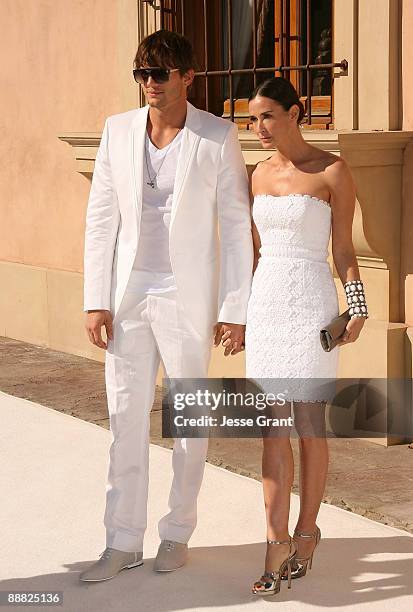 Actor Ashton Kutcher and actress Demi Moore arrive at the White Party hosted by Sean "Diddy" Combs and Ashton Kutcher to help raise awareness for...