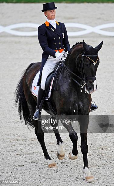 Dutch dressage rider Anky van Grunsven and her horse "Ips Salineron" compete in the Grand Prix Kur event of the CHIO World Equestrian Festival in...