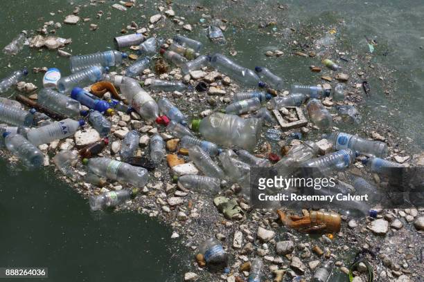 plastic bottles & garbage floating in indian ocean. - sea pollution stock pictures, royalty-free photos & images