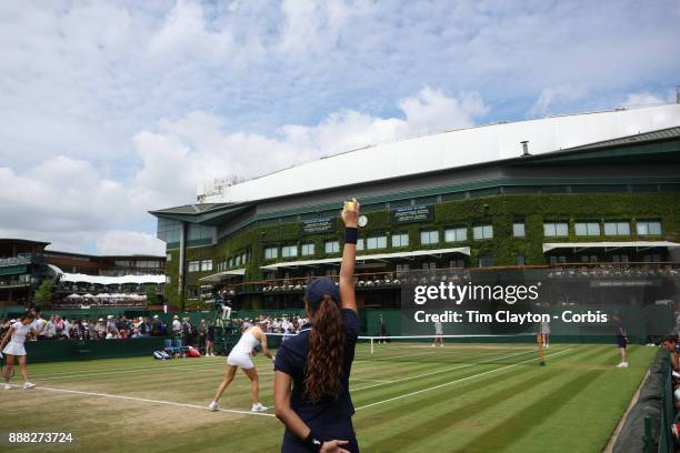 Ball girl holds a ball during Andrea Petkovic of Germany and Mirjana Lucic-Baroni of Croatia playing their Ladies' Doubles match against Lucie...