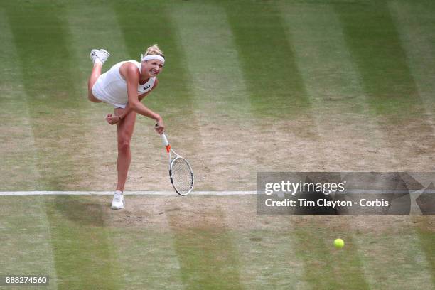 Times Bacsinszky of Switzerland in action against Agnieszka Radwanska of Poland on Centre Court during the Wimbledon Lawn Tennis Championships at the...