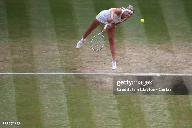 Times Bacsinszky of Switzerland in action against Agnieszka Radwanska of Poland on Centre Court during the Wimbledon Lawn Tennis Championships at the...