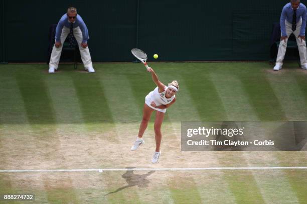 Times Bacsinszky of Switzerland in action against Agnieszka Radwanska of Poland on Centre Court during the Wimbledon Lawn Tennis Championships at the...