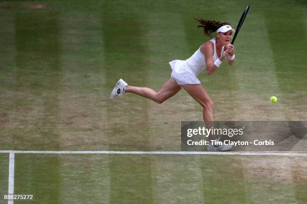 Agnieszka Radwanska of Poland in action against Times Bacsinszky of Switzerland on Centre Court during the Wimbledon Lawn Tennis Championships at the...