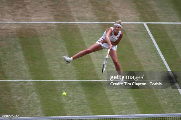 Times Bacsinszky of Switzerland in action against Agnieszka Radwanska of Poland on Centre Court during the Wimbledon Lawn Tennis Championships at the...