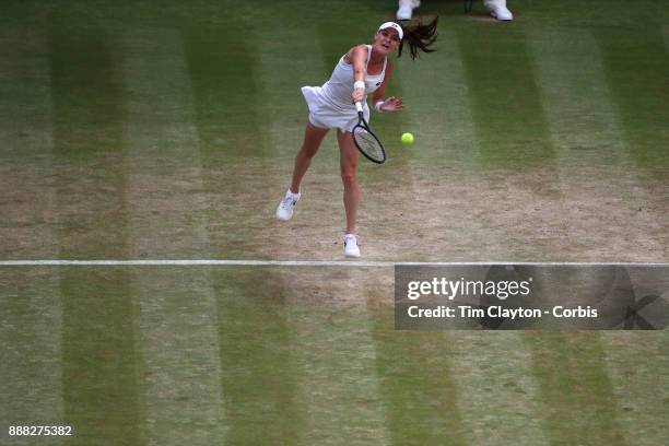 Agnieszka Radwanska of Poland in action against Times Bacsinszky of Switzerland on Centre Court during the Wimbledon Lawn Tennis Championships at the...