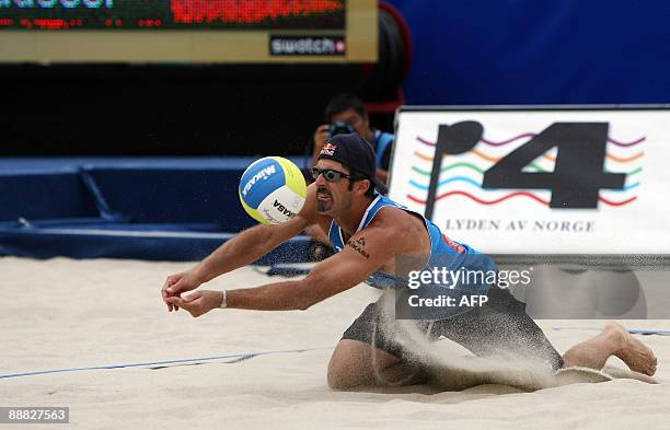 Player Todd Rogers hits the ball during his match against David Klemperer and Eric Koren of Germany at the FIVB Beach Volleyball World Championships...