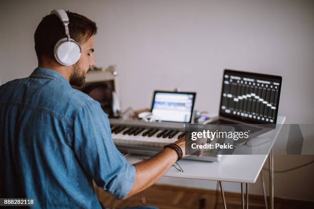 music producer at place of work - electric piano stock pictures, royalty-free photos & images