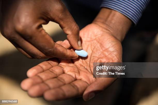 Thembelani Sibanda shows the Pre-Exposure Prophylaxis , an HIV preventative drug during an interview on November 30, 2017 in Soweto, South Africa....