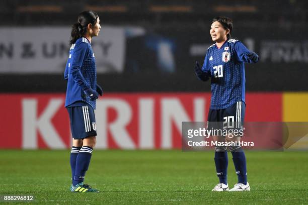 Aya Sameshima and Miho Manya of Japan talk during the EAFF E-1 Women's Football Championship between Japan and South Korea at Fukuda Denshi Arena on...