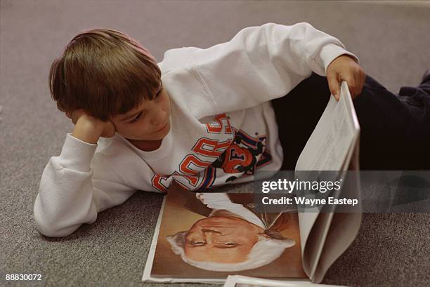 boy reading book - class president stock pictures, royalty-free photos & images