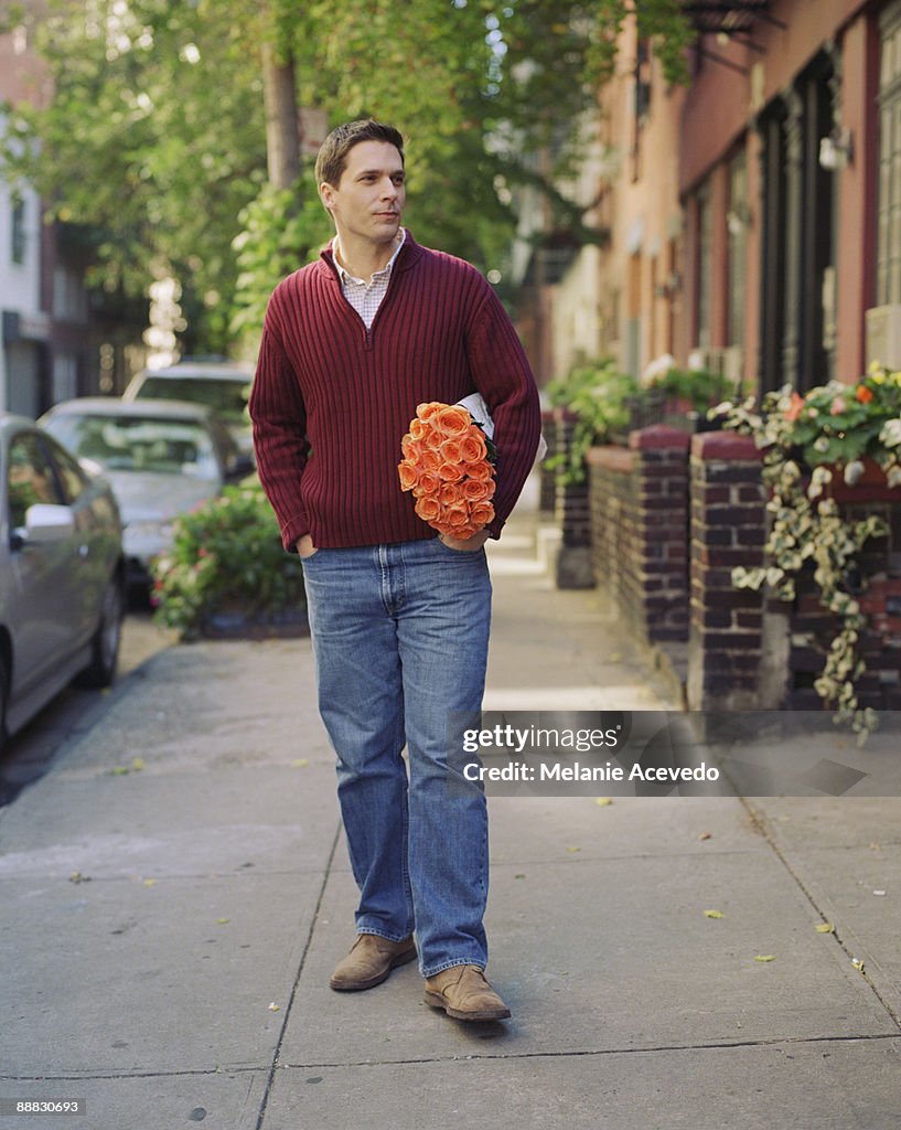 Man with bouquet of roses