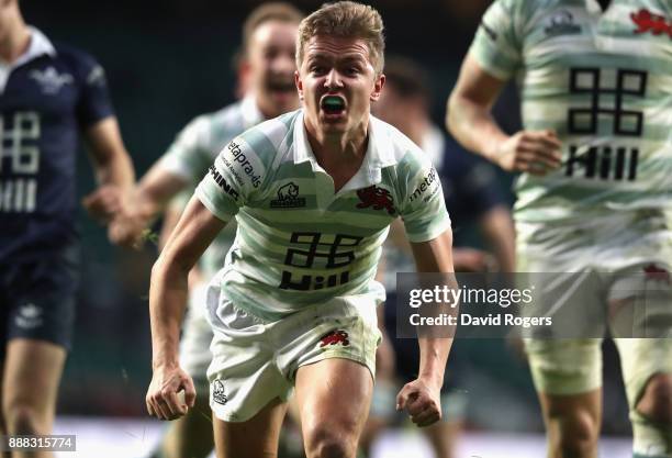 Chris Bell of Cambridge celebrates after scoring the first try during the Varsity match between Oxford University and Cambridge University at...