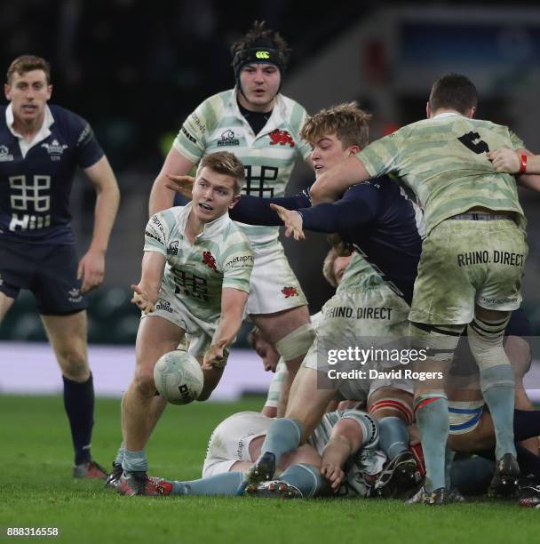 Chris Bell of Cambridge passes the ball during the Varsity match between Oxford University and Cambridge University at Twickenham Stadium on December...