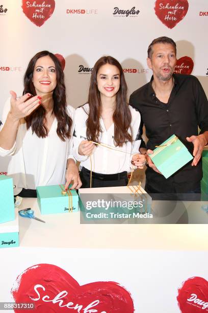 Bettina Zimmermann, Luise Befort and Kai Wiesinger during the X-Mas charity campaign 'Schenken mit Herz' on December 8, 2017 in Hamburg, Germany.