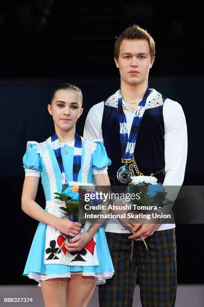 Apollinariia Panfilova and Dmitry Rylov of Russia pose on the podium after competing in the pairs free skating during the ISU Junior & Senior Grand...