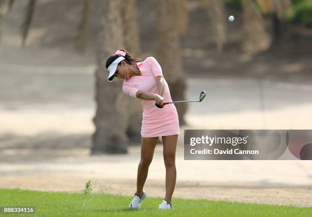 Muni He of China plays her second shot on the par 4, 12th hole during the third round of the 2017 Dubai Ladies Classic on the Majlis Course at The...