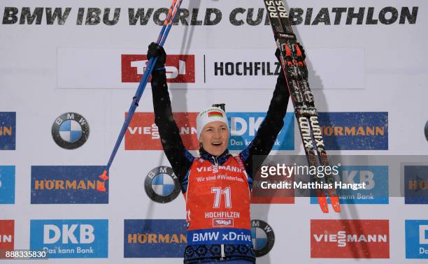 Darya Domracheva of Belarus celebrates on the podium after winning the 7.5 km Women's Sprint during the BMW IBU World Cup Biathlon on December 8,...