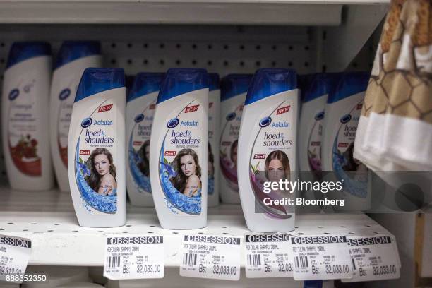 Bottles of "hoed & shouders" shampoo sit on display for sale at a grocery store in Caracas, Venezuela, on Tuesday, Nov. 28, 2017. In Venezuela,...