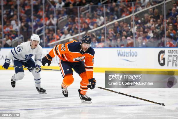 Eric Gryba of the Edmonton Oilers is pursued by James van Riemsdyk of the Toronto Maple Leafs at Rogers Place on November 30, 2017 in Edmonton,...