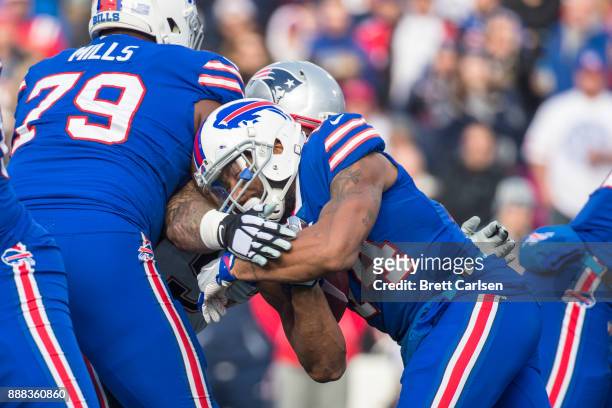 Joe Webb of the Buffalo Bills carries the ball during the first quarter against the New England Patriots at New Era Field on December 3, 2017 in...