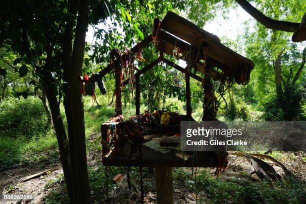 Human remains lie entombed and in the open air at Choeung Ek, the site of a former orchard and mass grave of victims of the Khmer Rouge on September...