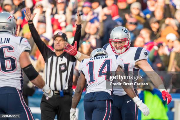 Rex Burkhead of the New England Patriots celebrates scoring a touchdown during the second half with his teammate Brandin Cooks against the Buffalo...