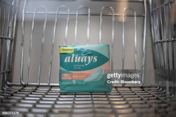 Package of "aluays" sanitary pads sit in a shopping cart in an arranged photograph at a grocery store in Caracas, Venezuela, on Tuesday, Nov. 28,...