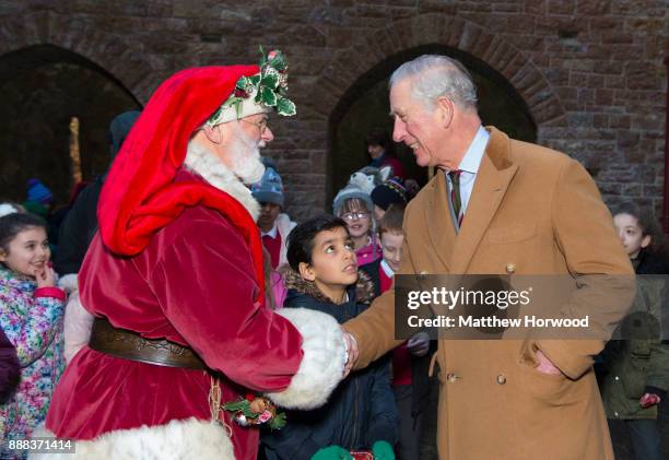 Prince Charles, The Prince of Wales meets Father Christmas during a visit to Castell Coch to learn about the castle's history, refurbishment and...