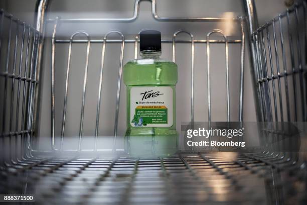 Bottle of "Tans" mouthwash sits in a shopping cart in an arranged photograph at a grocery store in Caracas, Venezuela, on Tuesday, Nov. 28, 2017. In...