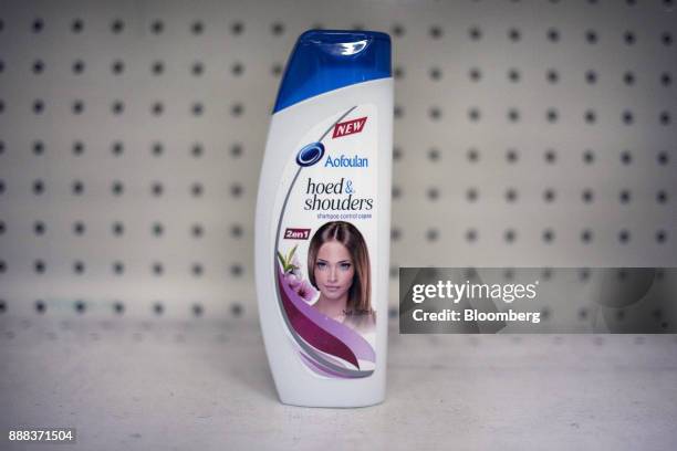 Bottle of "hoed & shouders" sits on a shelf in an arranged photograph at a grocery store in Caracas, Venezuela, on Tuesday, Nov. 28, 2017. In...