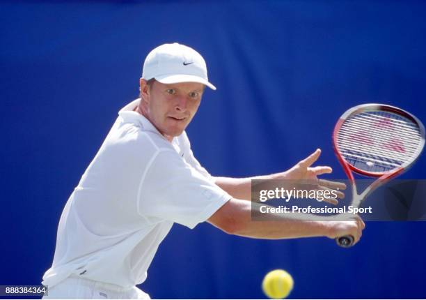 Yevgeny Kafelnikov of Russia in action during a Men's Singles match in the tennis event at the Summer Olympic Games at the NSW Tennis Centre in...