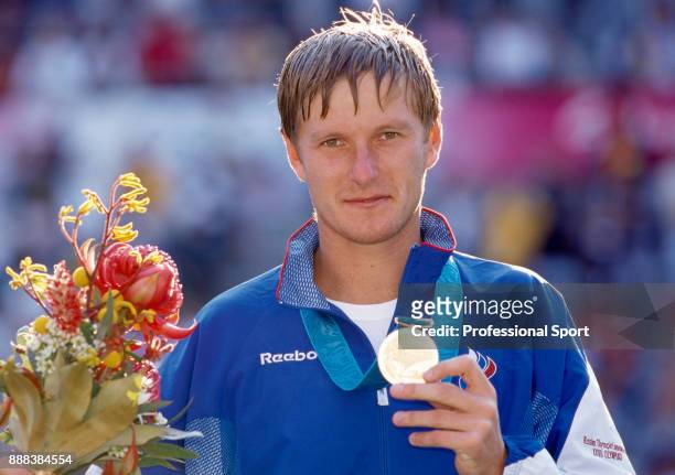Yevgeny Kafelnikov of Russia poses with the gold medal after defeating Tommy Haas of Germany in the Men's Singles Gold Medal Match in the tennis...