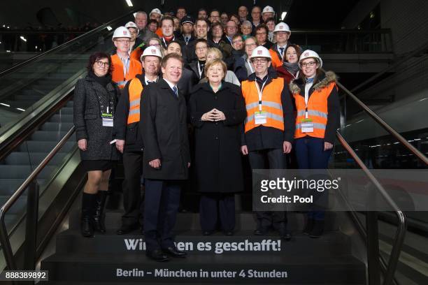 German Chancellor Angela Merkel poses for a group photo after the inauguration of a high-speed ICE train of German state rail carrier Deutsche Bahn...