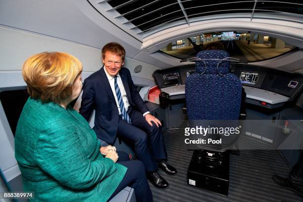 German Chancellor Angela Merkel rides in the train driver's cockpit of a high-speed ICE train of German state rail carrier Deutsche Bahn on the...